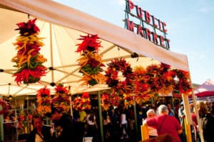 Colorful pepper wreaths under Public Market sign