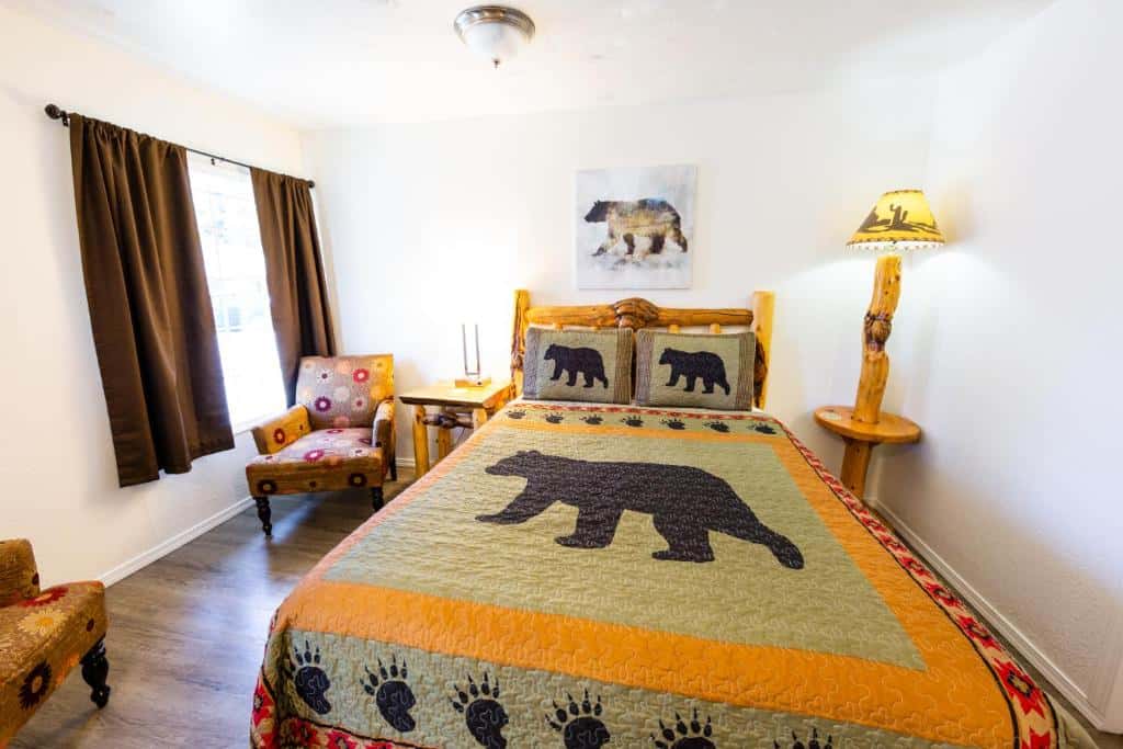 Comfortable bear-themed guest room at Arbor Inn Motel in Oakridge Oregon